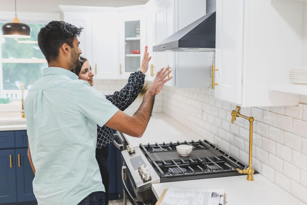 Post‑Construction Final Inspection for Sydney Kitchen Renovations Two people inspecting a newly completed kitchen during the post‑construction final review for a Sydney renovation project