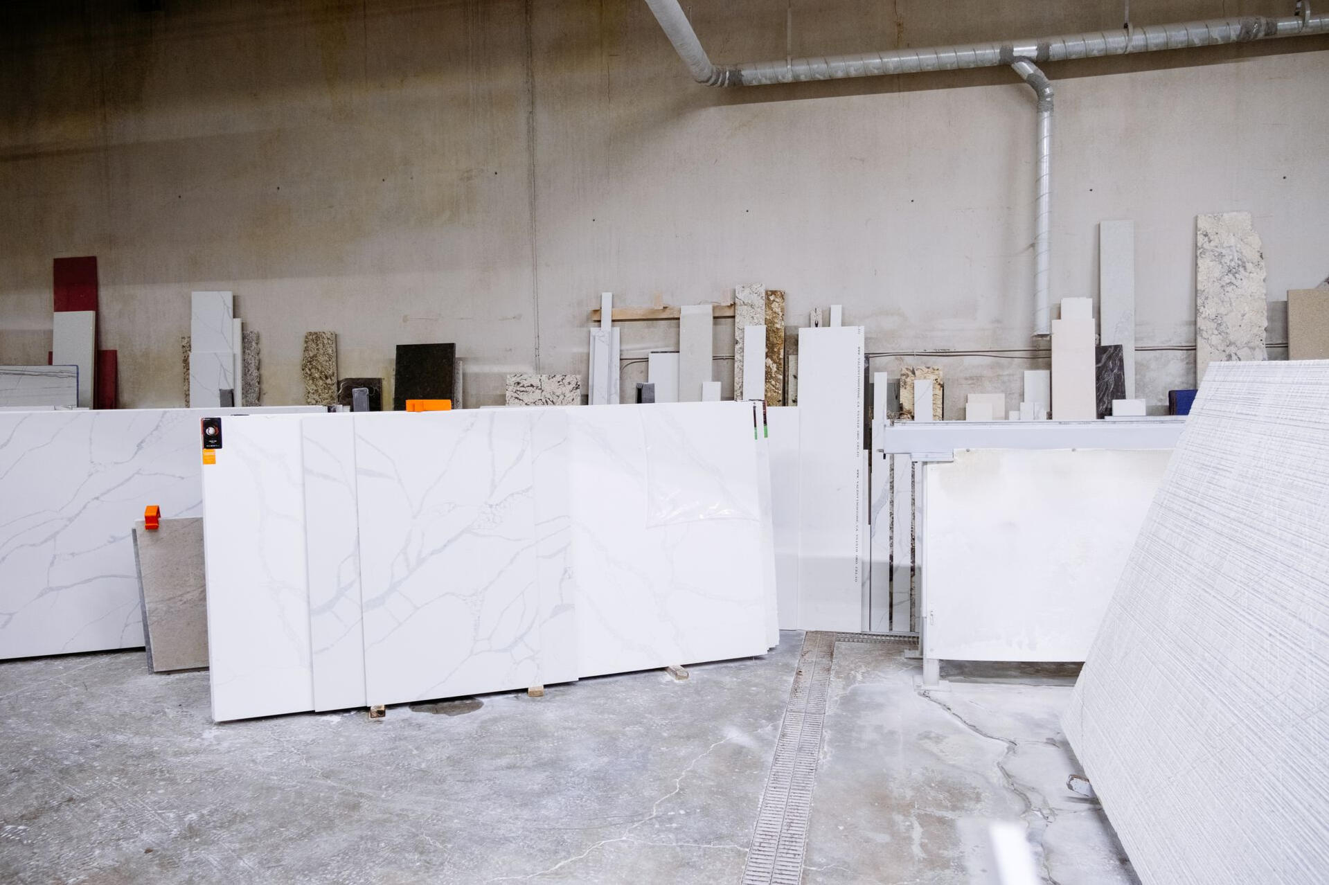 How Sydney Budget Kitchens Secures Materials for Smooth Renovations Organised stone and renovation materials stored in a warehouse, showing how Sydney Budget Kitchens prepares early to ensure a seamless renovation experience