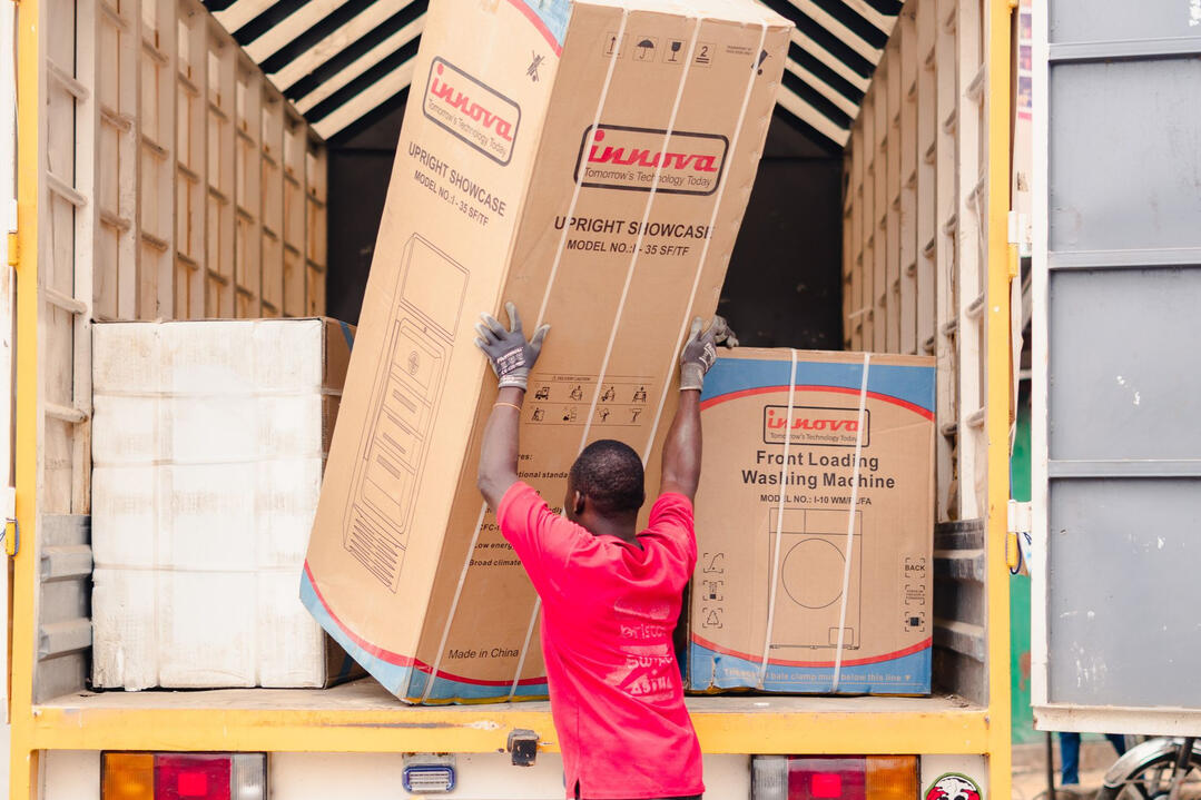 Sydney Renovation Materials Delivery and Construction Preparation Worker unloading construction materials from a truck as part of scheduled delivery for a Sydney kitchen or bathroom renovation project